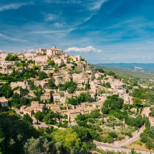 Gordes, Provence, France. Beautiful Scenic View Of Medieval Hilltop Village Of Gordes. Sunny Summer Sky. Famous Landmark